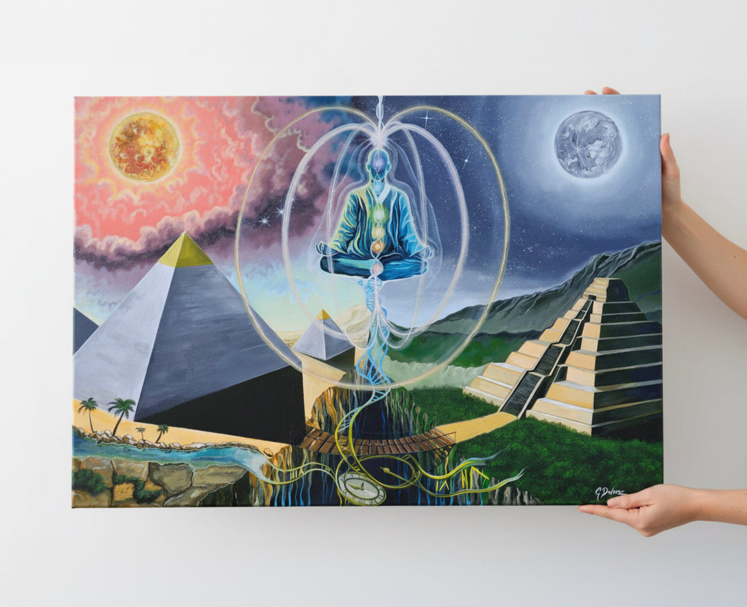 Person holding a large poster with a mystical design featuring a meditating figure, pyramids, and celestial elements.